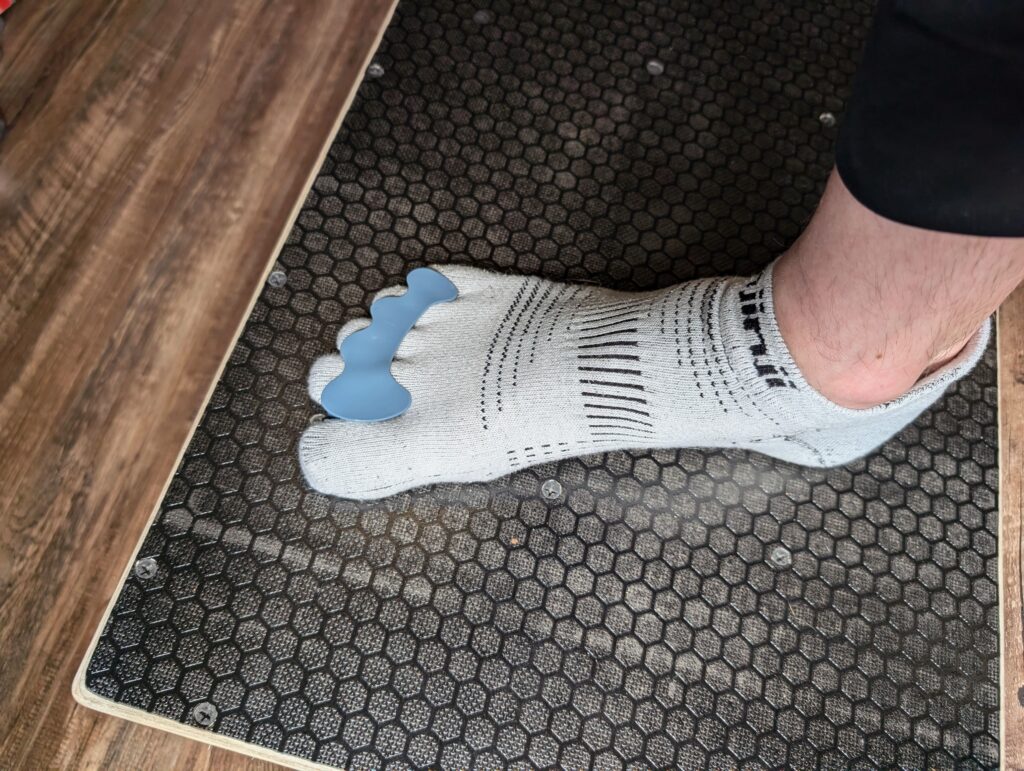 Injinji Socks and Correct Toe toe orthotics on a slant board for proper foot musculature activation